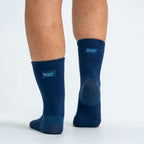 Navy bamboo compression foot sleeves worn on both feet