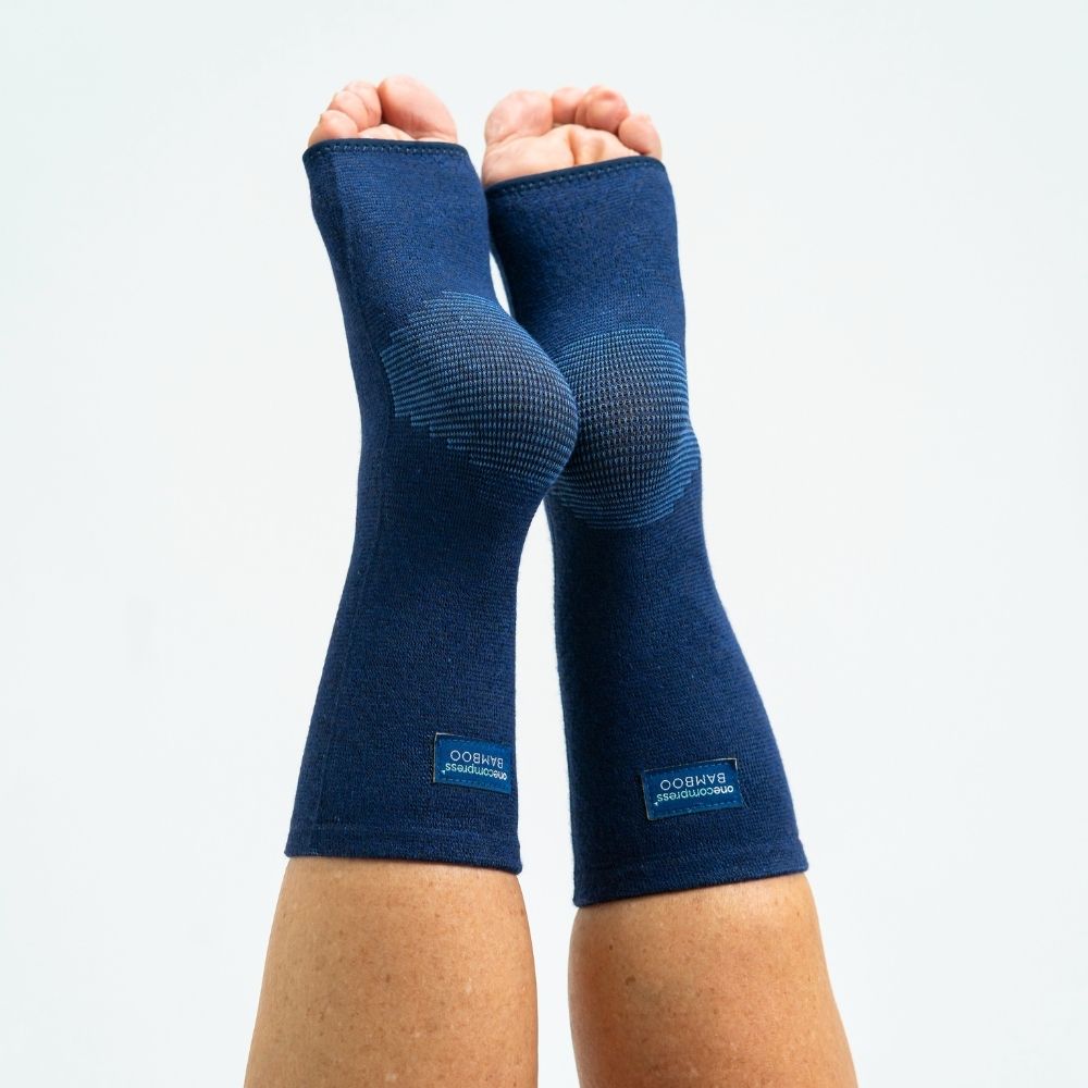 Navy bamboo compression foot sleeves showing ankle and arch coverage