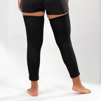 Black full-leg compression sleeves worn on both legs