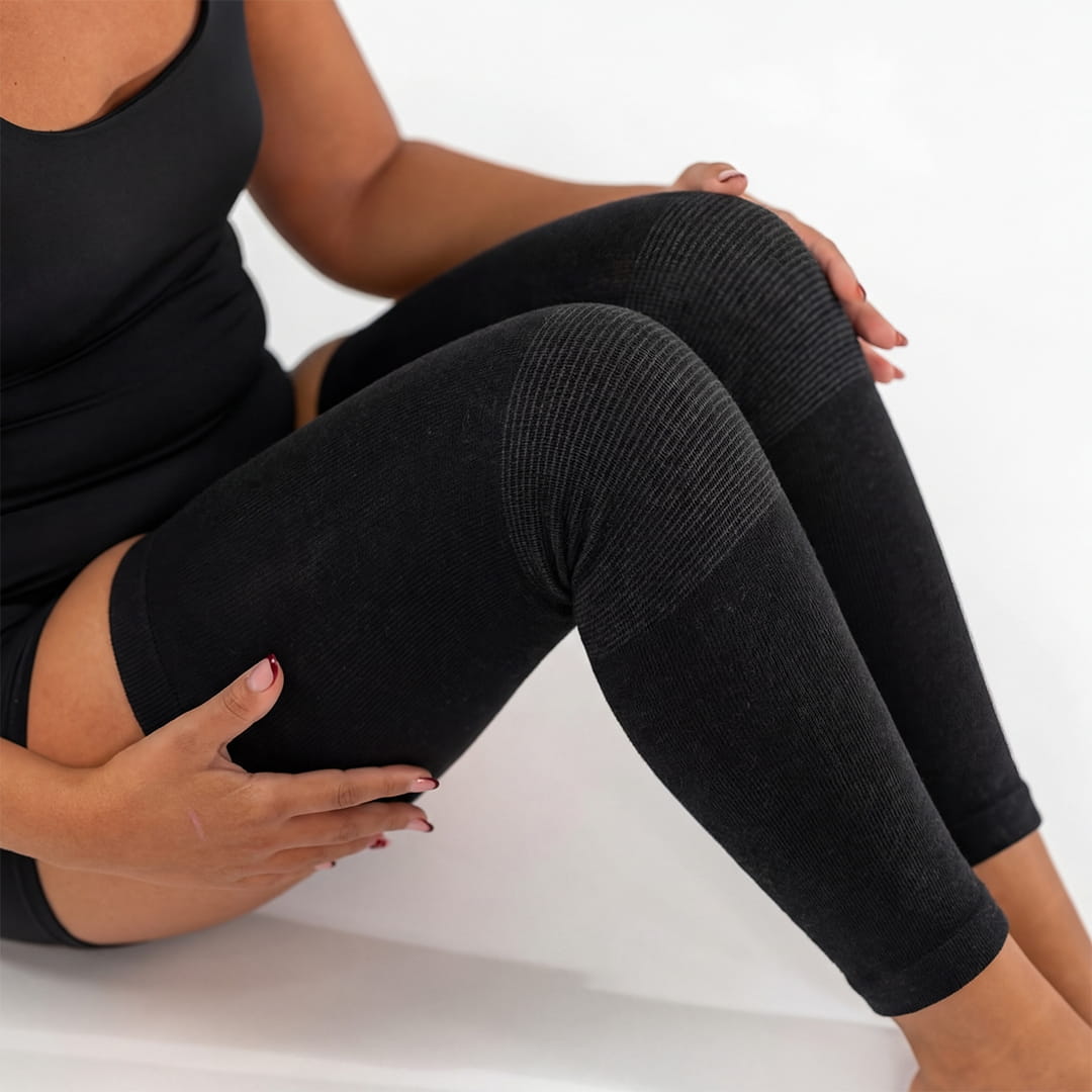 Black bamboo compression leg sleeve worn while seated