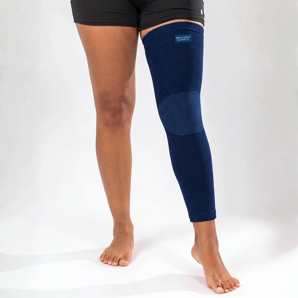 Navy bamboo compression leg sleeve worn from thigh to ankle
