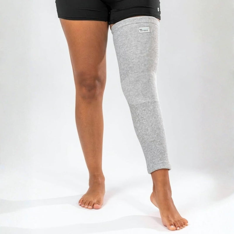 Gray bamboo compression leg sleeve worn from thigh to ankle