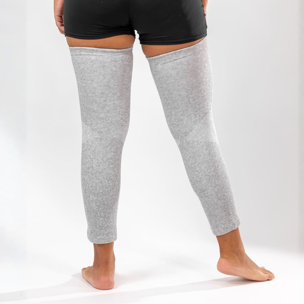 Gray compression leg sleeve worn on both legs